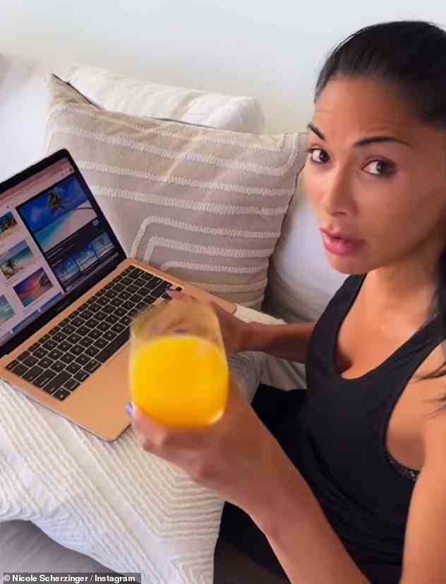 Träumen: In einem kürzlich erschienenen Video ist Nicole zu sehen, wie sie in schwarzer Sportkleidung eine lässige Figur macht, während sie auf ihrem Laptop durch die Feiertage scrollt