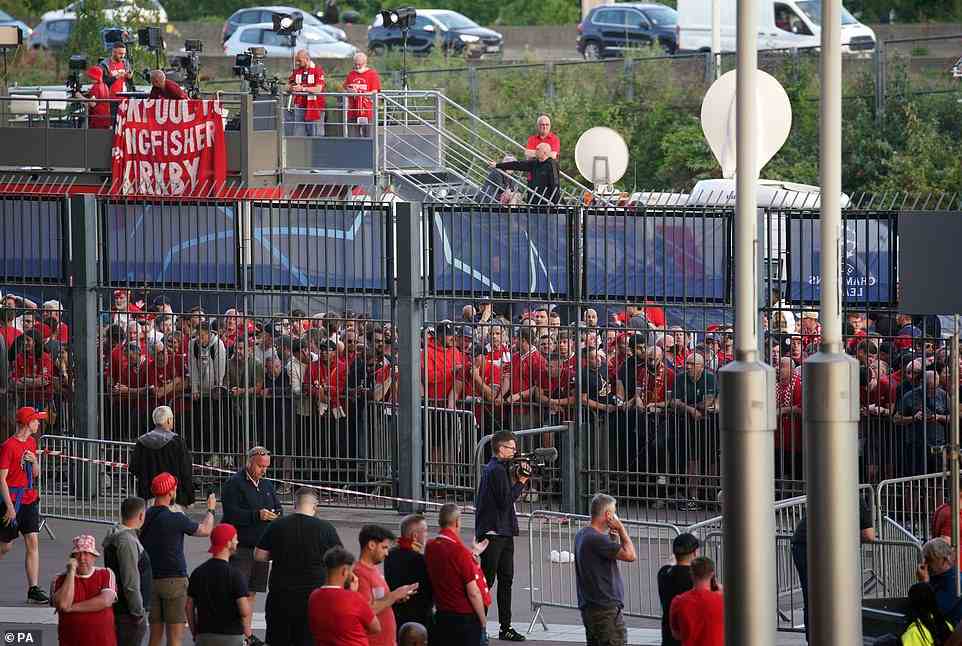 Liverpool fans queue to gain entry to the stadium as kick off was delayed ahead of the UEFA Champions League Final at the Stade de France, Paris