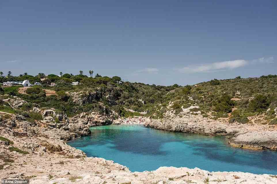 CALA BINIDALI, MENORCA EAST: If you're in the market for an 'unspoilt cove', Cala Binidali could be for you. It's accessed via 'a steep hike down from [a] car park', with 'great snorkelling and rock jumping' available around the headland at a little boathouse opposite Som Sis beach bar that you can reach by descending a set of steps. Coordinates: 39.8342, 4.1979