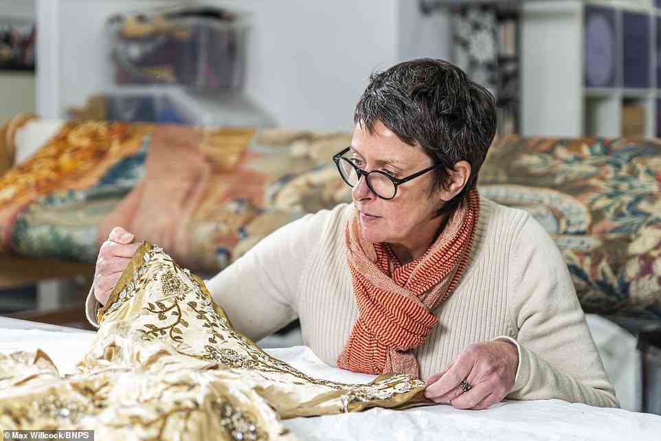 All in the details: Emma, a specialist in tapestry conservation and historic house interior textiles, was called in and tasked with the enormous challenge of repairing the dress