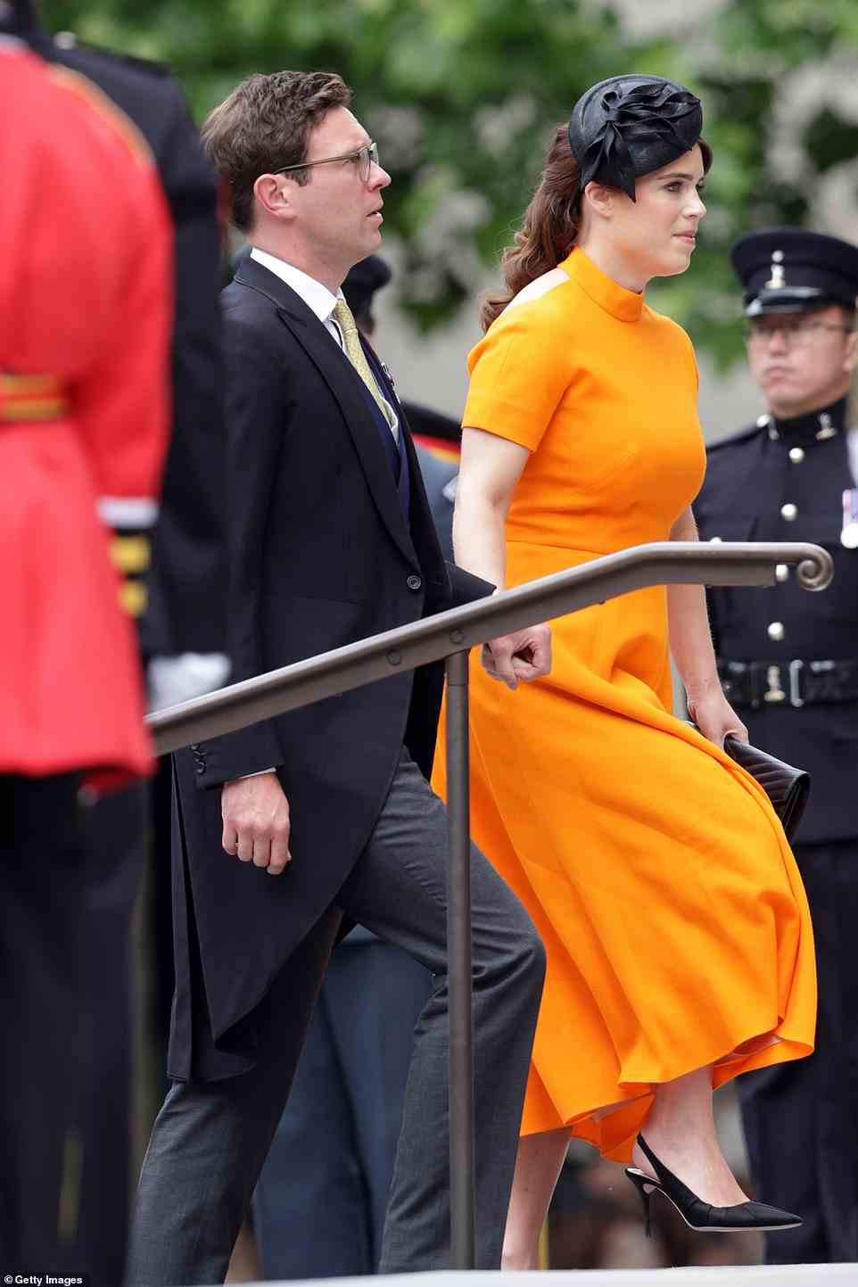 Eugenie stepped on the stairs of the cathedrals in a pair of stylish black slip -ons heels, which matched the pretty hat she chose to wear today