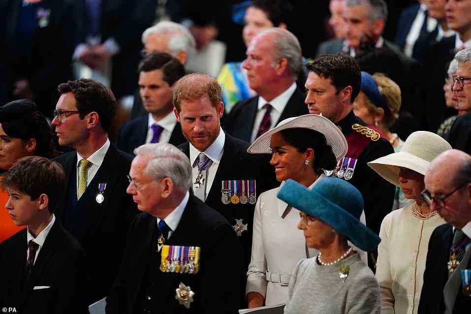 The Duke and Duchess of Sussex looked to be enjoying the occasion as they chatted to fellow royals seated around them (Pictured from right: Lady Sarah Chatto, the Sussexes, Jack Brooksbank, Princess Eugenie, bottom row from left, the Duke of Kent, the Duke and Duchess of Gloucester, Prince Edward and Sophie Wessex's son James, Viscount Severn)