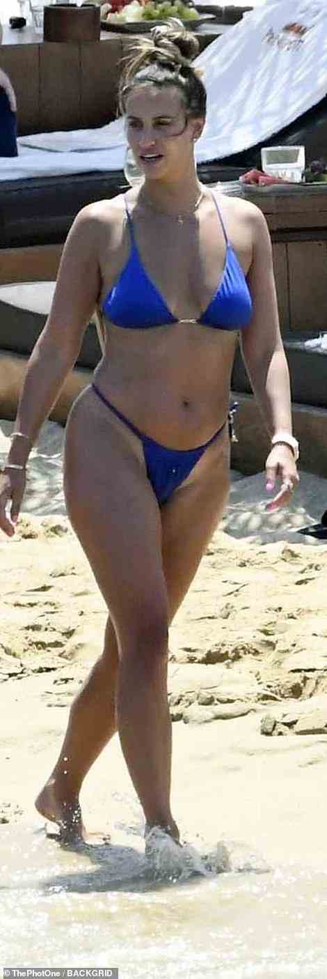 Incredible: The former TOWIE star, 31, looked sensational in an electric blue bikini while flashing her prominent tan lines