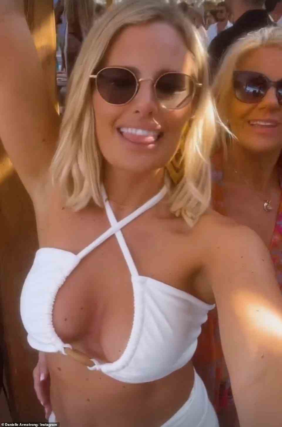 Bride to be: Danielle Armstrong, 34, showed off her toned physique in a cleavage plunging, stringy white bikini as she partied in Greece for her hen do