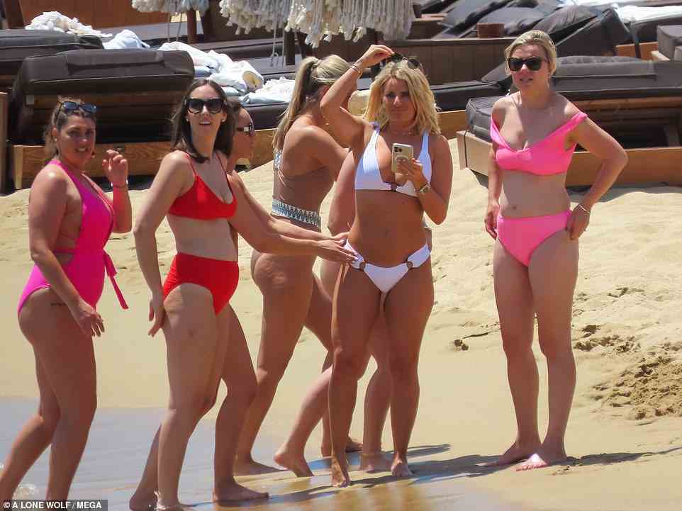 Pals: Danielle and her friends sported colourful swimsuits as they enjoyed a day at the beach for the star's hen do in Mykonos, Greece