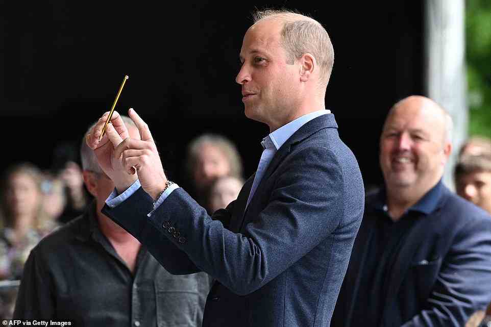 Meanwhile Prince William gave conducting Sweet Caroline a go during the visit earlier today at Cardiff Castle