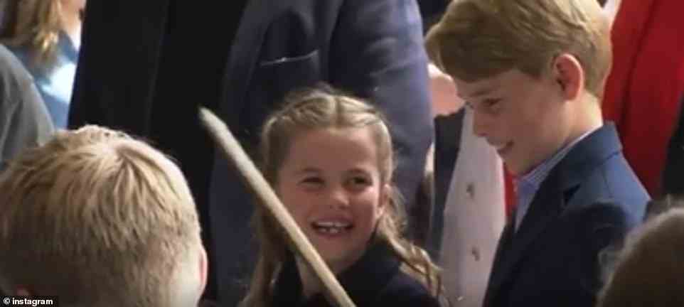 The little royal was seen laughing alongside her brother Prince George as they listened to We Don't Talk About Bruno
