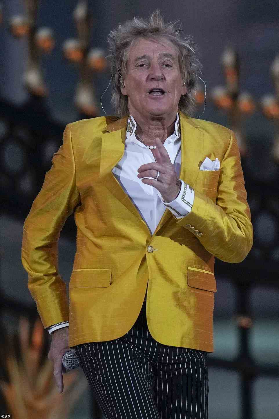 Boogie: And Sir Rod Stewart then got the crowds dancing as he belted out Baby Jane with his recognisable raspy vocals alongside three back-up singers, who wore dresses mirroring the Union Jack colours