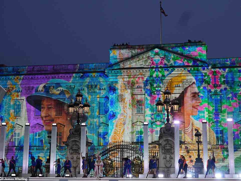 Vibrant: With pictures of the Queen and '70 years on' projected on Buckingham Palace in a colourful display behind them, the British band sang Girl On Film in what seemed to be a pop-inspired tribute to Her Majesty