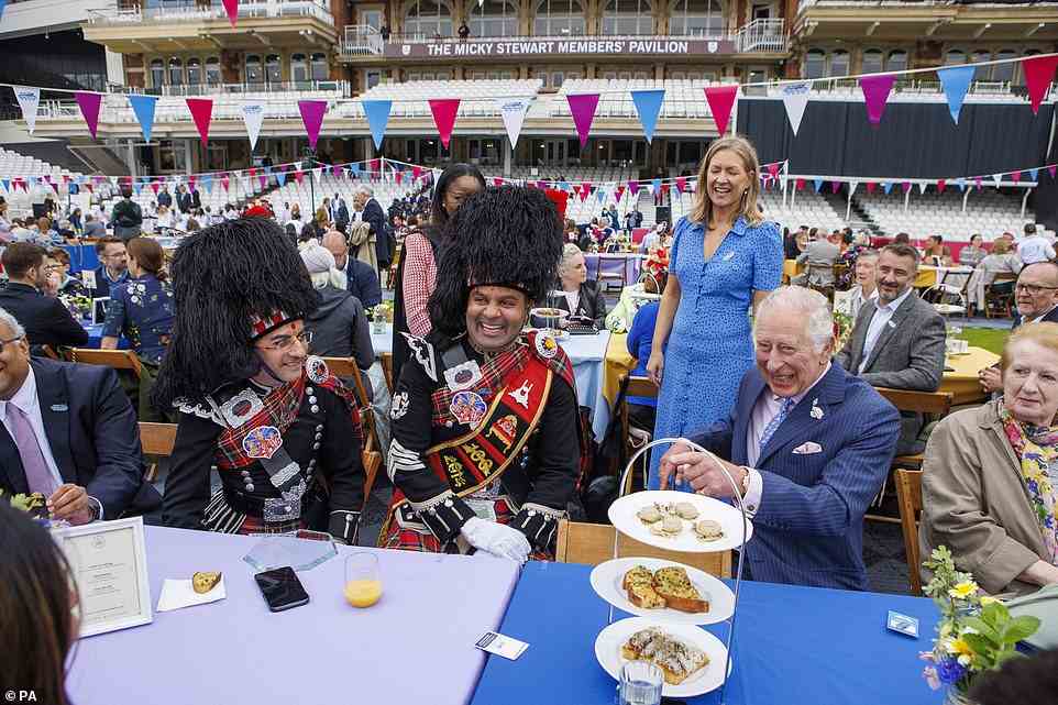 The Prince of Wales laughing as he enjoys food and drinks at the Oval in London, June 5, 2022