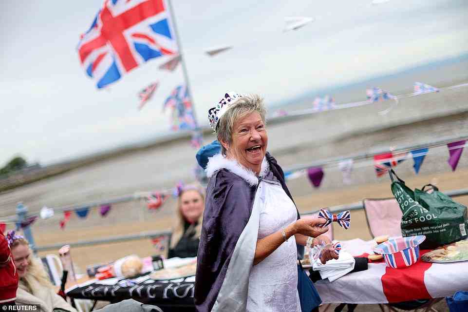 A woman reacts as she takes part in the Morecambe Town Council street party, June 5, 2022