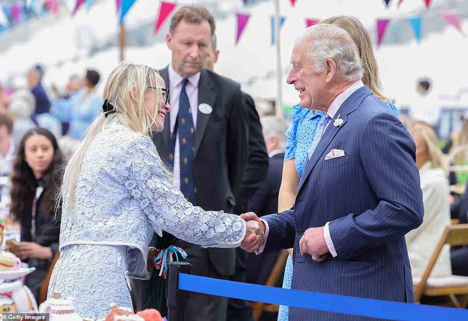 Prince Charles shakes hands as he attends the Big Jubilee Lunch with Camilla at The Oval on June 5, 2022