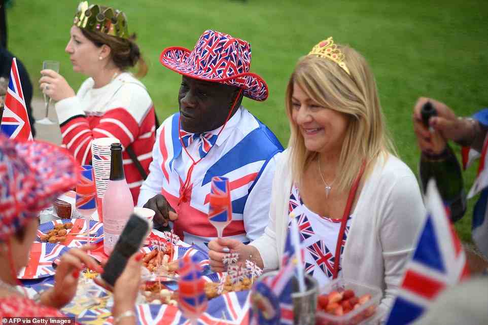Revellers dress in Union reds, whites and blues at the Big Jubilee Lunch on The Long Walk in Windsor on June 5, 2022