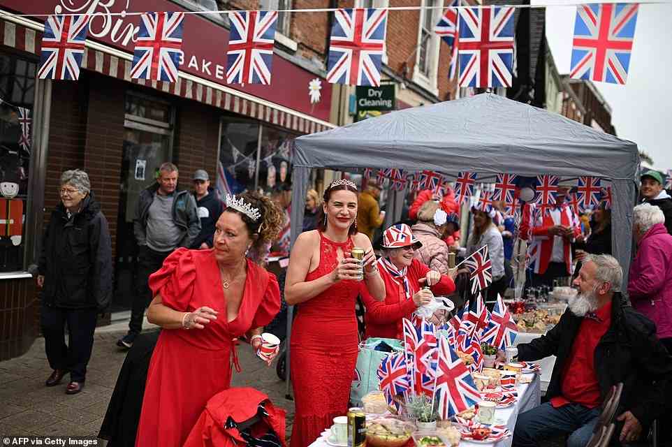 Happy revellers dress in patriotic reds, whites and blues at a street party in  Ashby-de-la-Zouch on June 5, 2022
