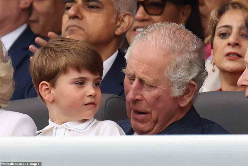 Prince Louis sits on his grandfather Prince Charles' lap during the Platinum Jubilee Pageant, June 5, 2022