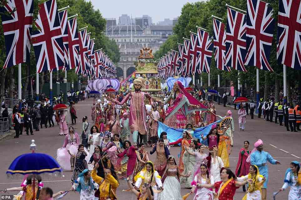 People parade during the Platinum Jubilee Pageant in front of Buckingham Palace, London, June 5, 2022
