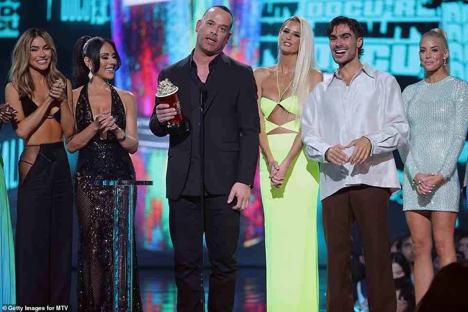 Producer: Producer Adam DiVello (center) accepted the award with his cast, thanking the fans while adding that 16 years ago this week, his other show, The Hills, debuted on MTV.