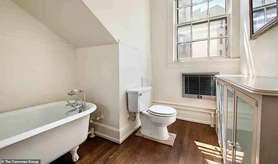 There are four-and-a-half bathrooms in the house, one of which includes a large, clawfoot soaking tub (pictured)