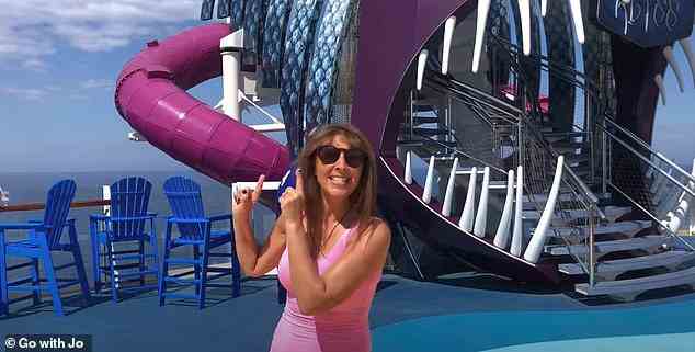 Jo stands outside the Ultimate Abyss slide, which plunges ten decks and must be ridden in a sack