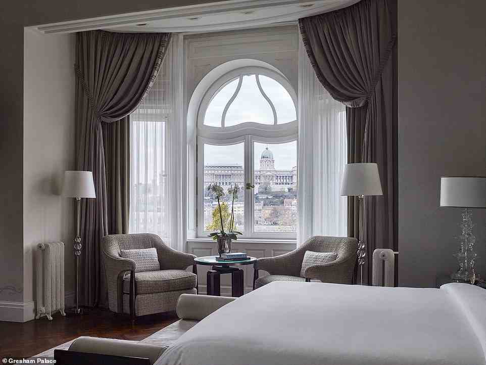'There is no shortage of hotels — but I can never resist the pricey but always reliable Gresham Palace,' writes Victor. Above is one of the hotel rooms with a view of Buda Castle