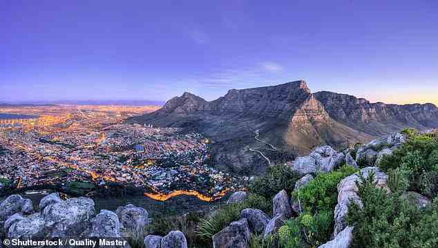 Black Tomato arranged an engagement 'on the most panoramic point of Table Mountain’, which looms over Cape Town, South Africa (above)