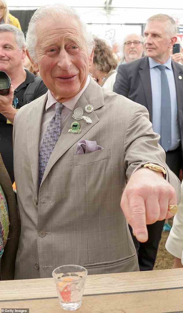 Prince Charles, Prince of Wales gestured to an exhibitor during a visit to the Royal Cornwall Show with Camilla, Duchess of Cornwall at The Royal Cornwall Showground