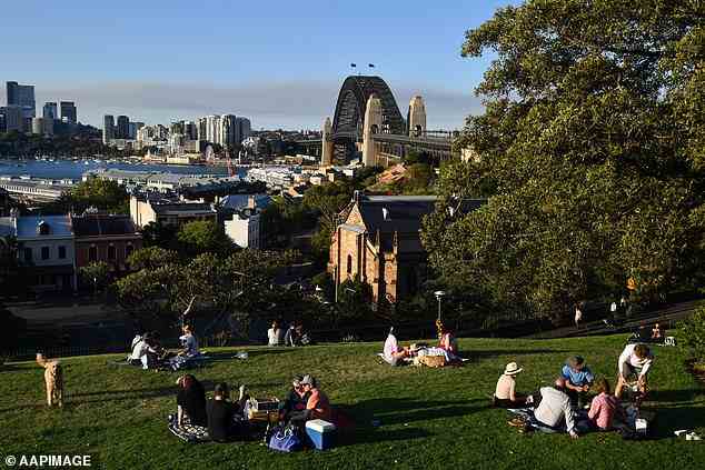 The east coast is set to receive a much-anticipated reprieve from cold and wintry conditions as a brutal cold snap finally comes to an end (pictured, locals enjoy a picnic in Sydney)
