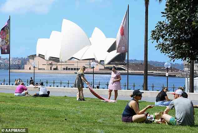 Sun-seekers across Australia can look forward to a warm end to the week as temperatures heat-up from Tuesday and last well into the weekend (pictured, residents in Sydney)