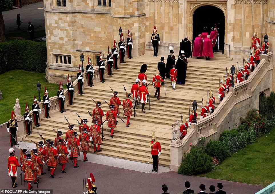 The procession enters St George's Chapel to attend the Most Noble Order of the Garter Ceremony in Windsor Castle in Windsor, west of London