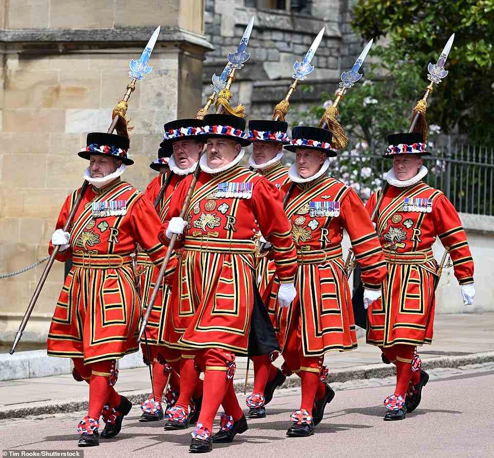 As the royals arrived at Windsor Castle for the event today, Beefeaters were seen marching through the street