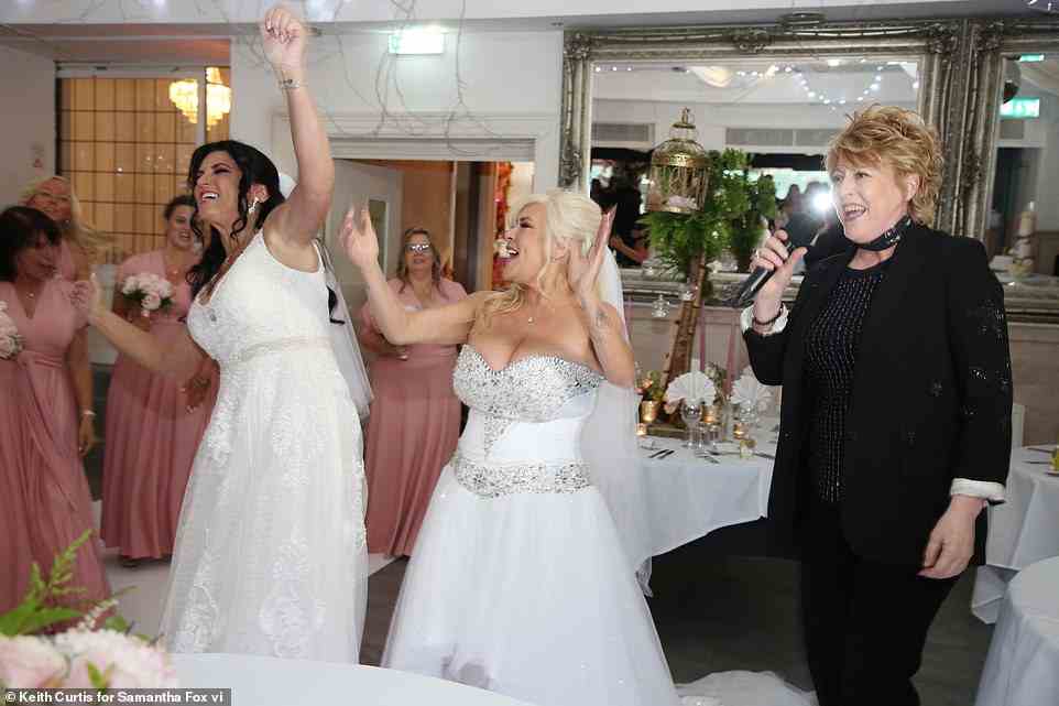 Dancing: They got their boogie on while their bridesmaids - wearing matching pink dresses - looked on