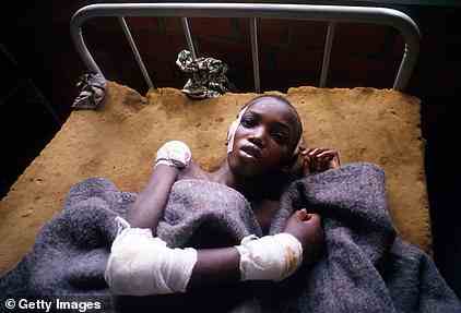 A Tutsi survivor of the genocide in Rwanda lies in his bed at Gahini hospital in Rwanda May 11, 1994