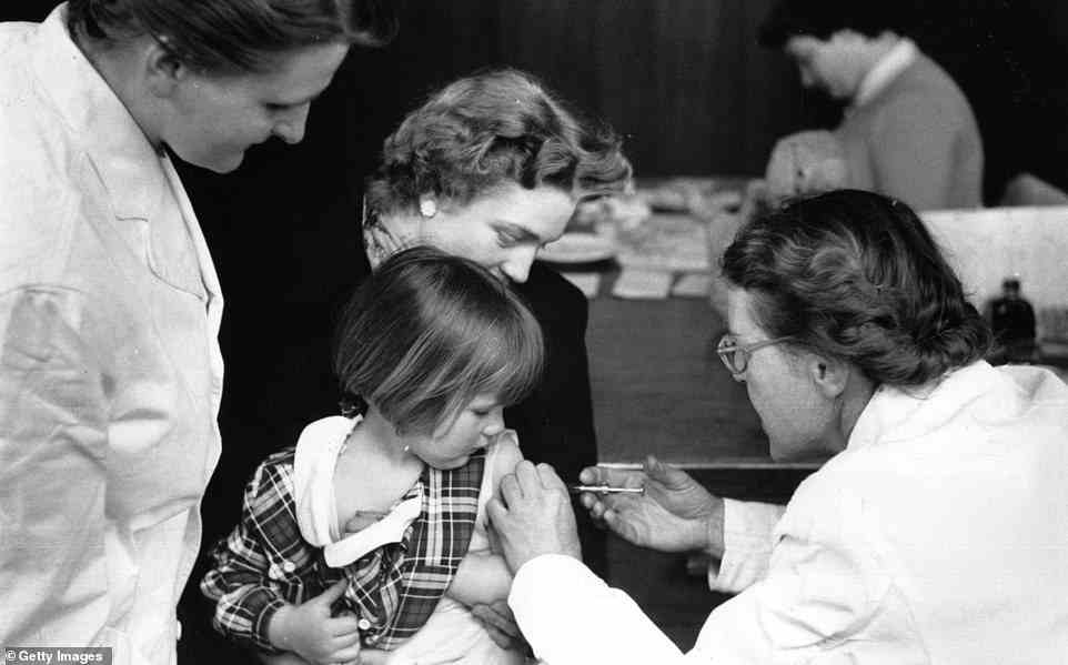 Great Britain was pronounced clear of polio in 2003 with the last case coming in 1984, but this week, experts repeatedly found samples of it in a waste water site in London. A young girl is pictured getting her polio jab in May 1956
