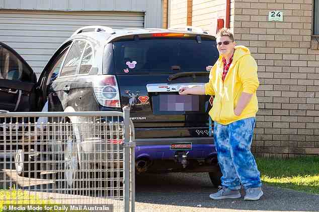 Clare Brown's wife Lauren Barr (above with her Gay Pride adorned car in Mount Druitt on Thursday) says that the heiress has such bad ADHD she needs a daily checklist to remind her to feed herself and their three cats