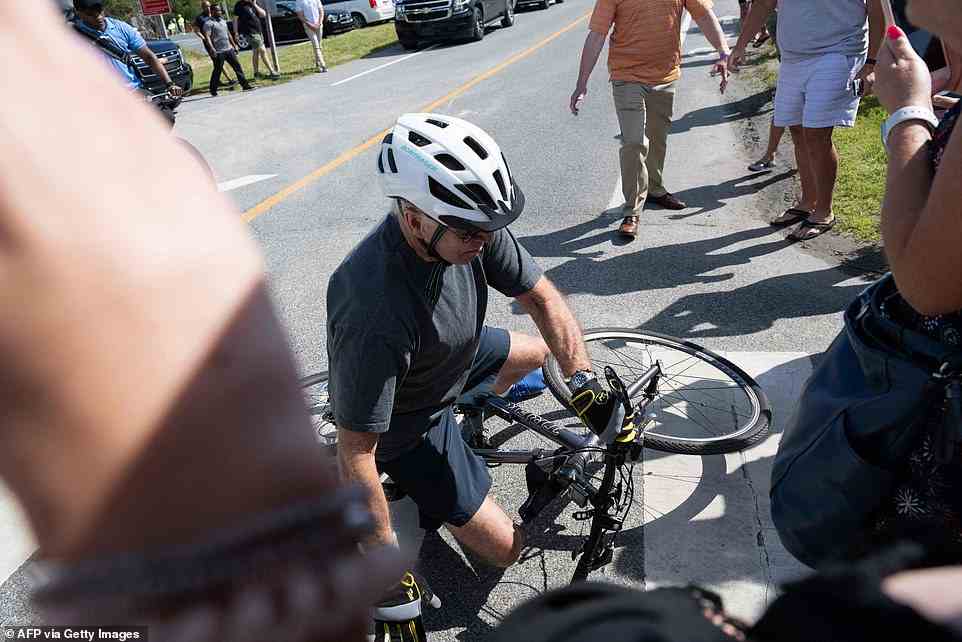 He told press 'I'm good' after falling over and taking his bike with him. Biden told reporters that he had trouble removing his shoes from the bikes' pedals, causing the fall