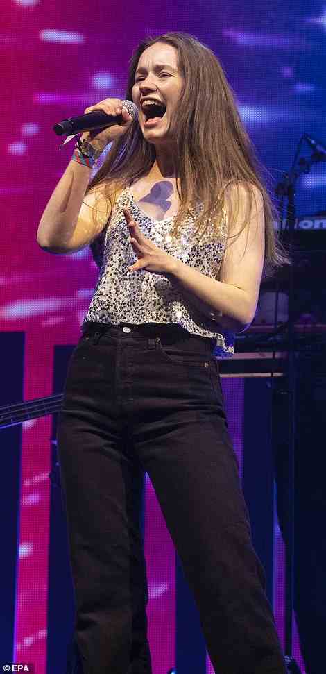 Striking: Sigrid looked chic in a strappy white top with silvery embellishments as she performed in a pair of black jeans