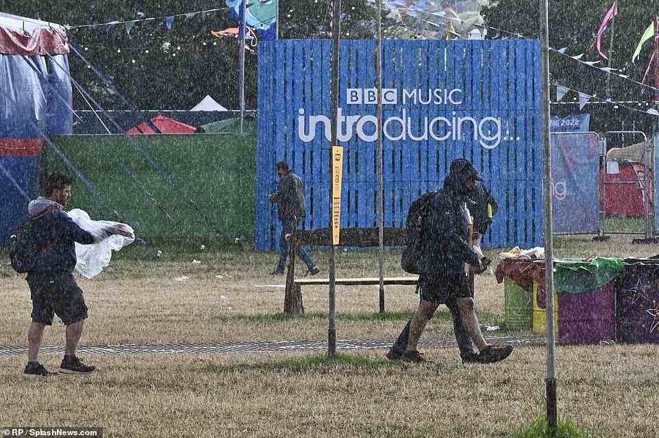 Showers also came in the form of light rain this morning in front of the BBC's Introducing... tent near campers in Glastonbury