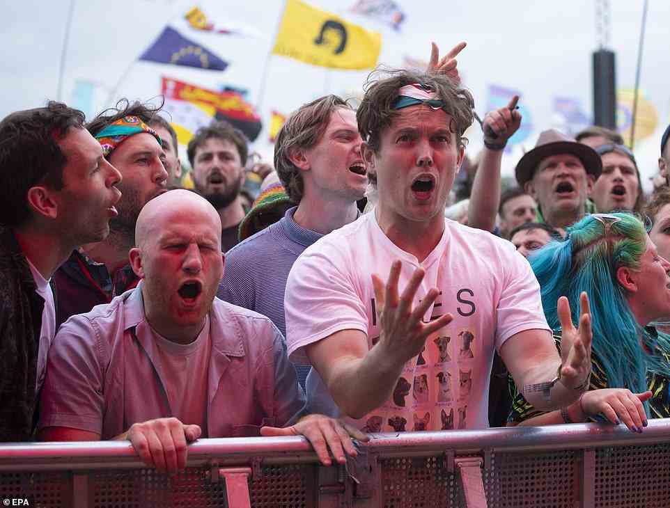 A pair of IDLES fans can barely contain their excitement as the British-Irish punk rock band played on the Other Stage