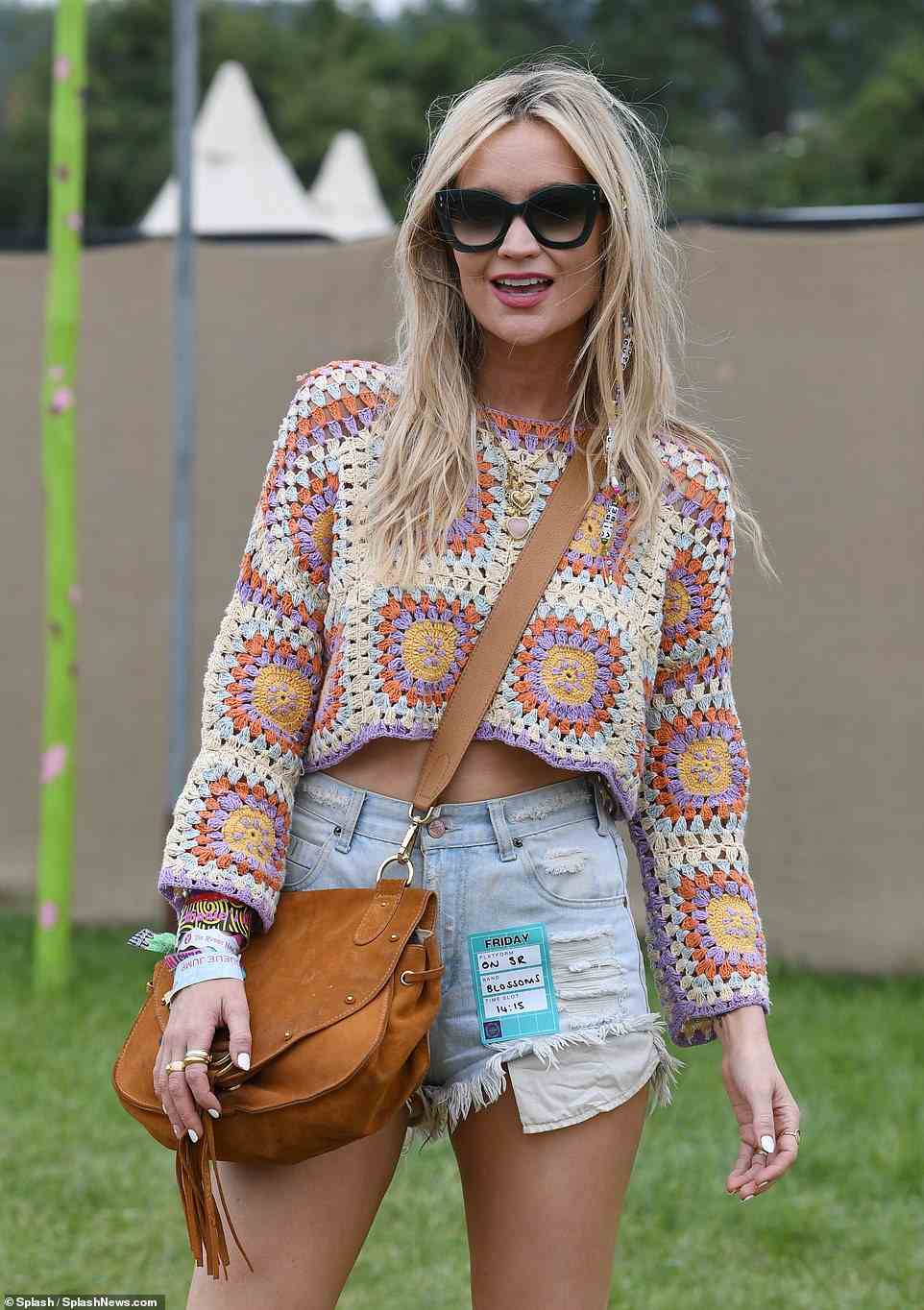Love Island host Laura Whitmore strikes a pose as she arrived at a wet Glastonbury Festival on Friday afternoon