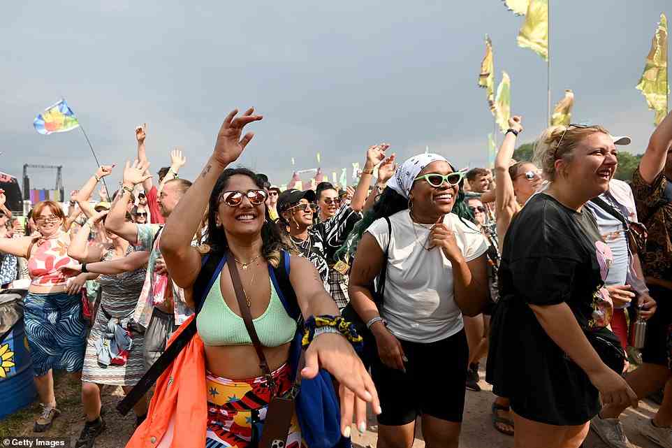 YESTERDAY - Festival goers enjoy the Notting Hill Carnival parade during day two of Glastonbury in the sunshine yesterday