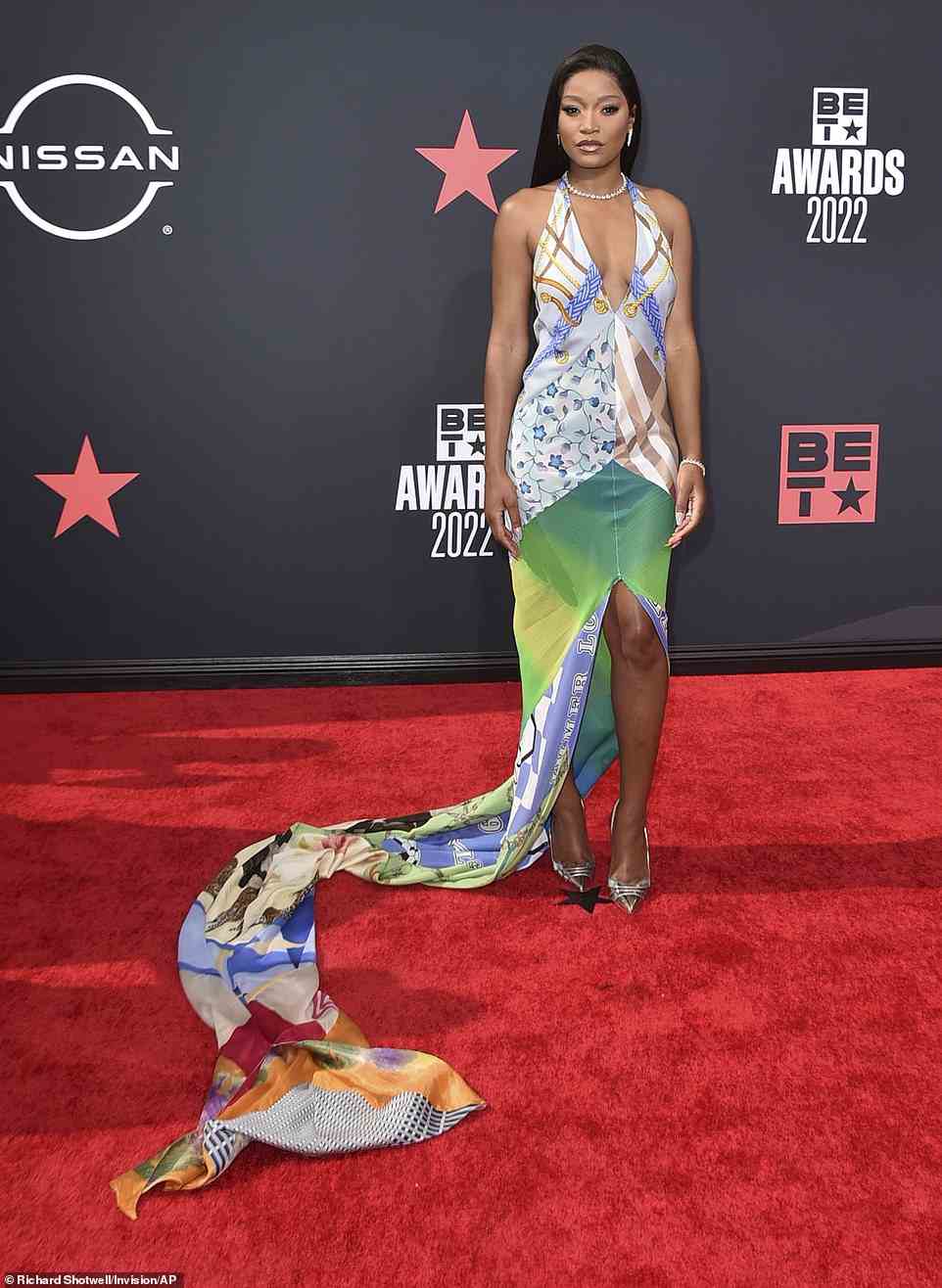 Effortlessly gorgeous: Actress Keke Palmer, 28, stunned at the event, wearing a plunging halter multi-pattern dress with a long train