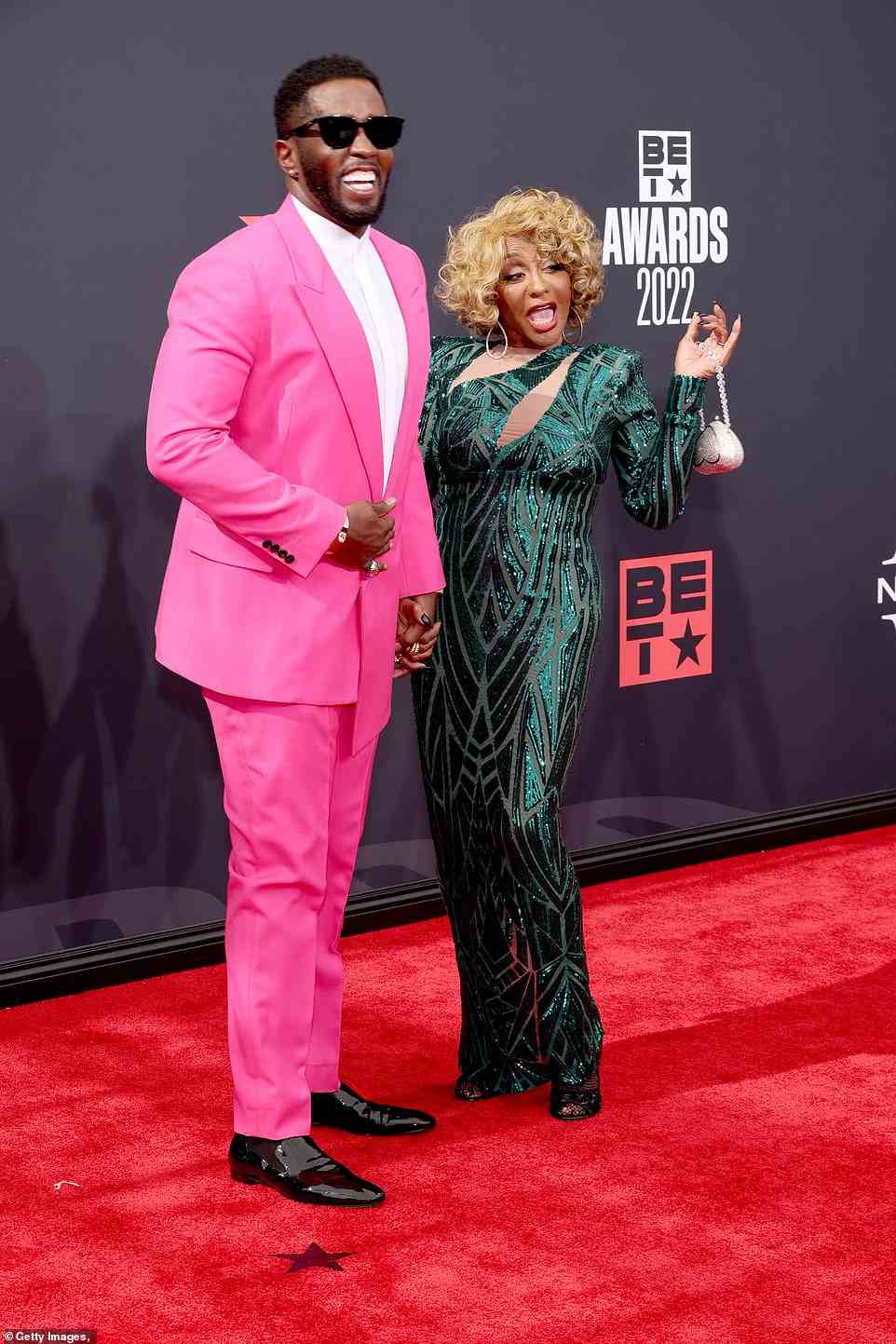Mother and son: He was seen posing with his mother, Janice Combs, who looked spectacular in a shimmery green gown and curly blonde hair