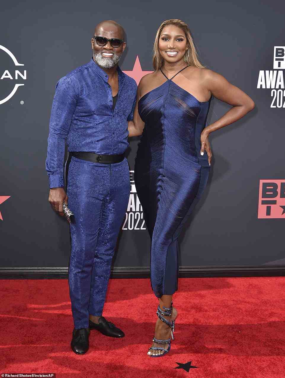 Matching: The Real Housewives of Atlanta star's boyfriend, Nyonisela Sioh, matched her in a navy silk set of his own