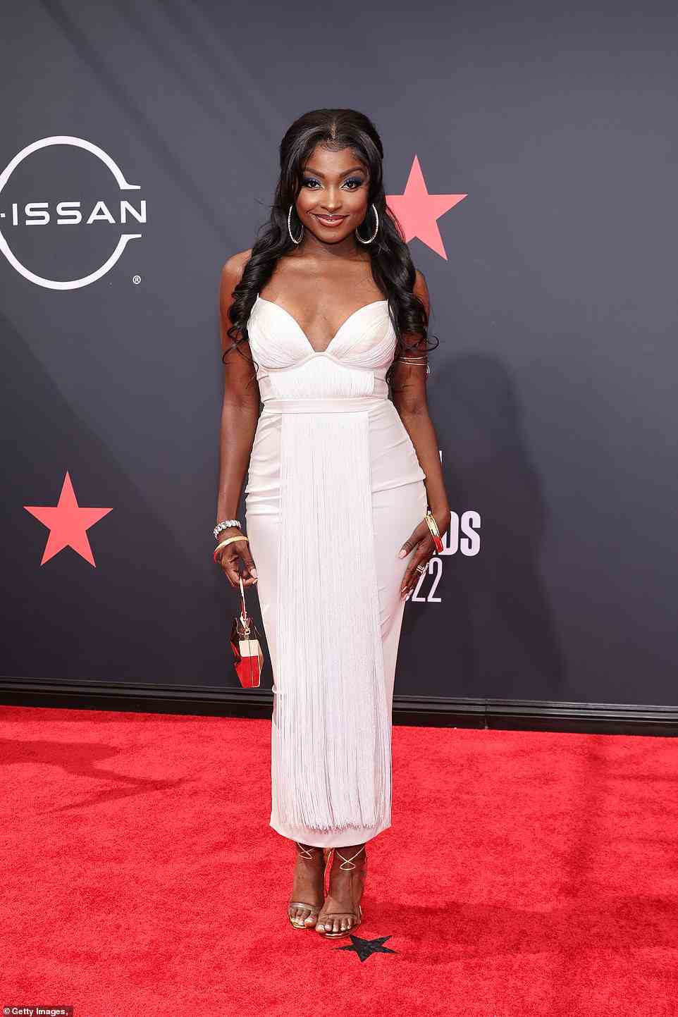 Ethereal: Loren Lott looked ethereal in a white form-fitting dress with a fringe