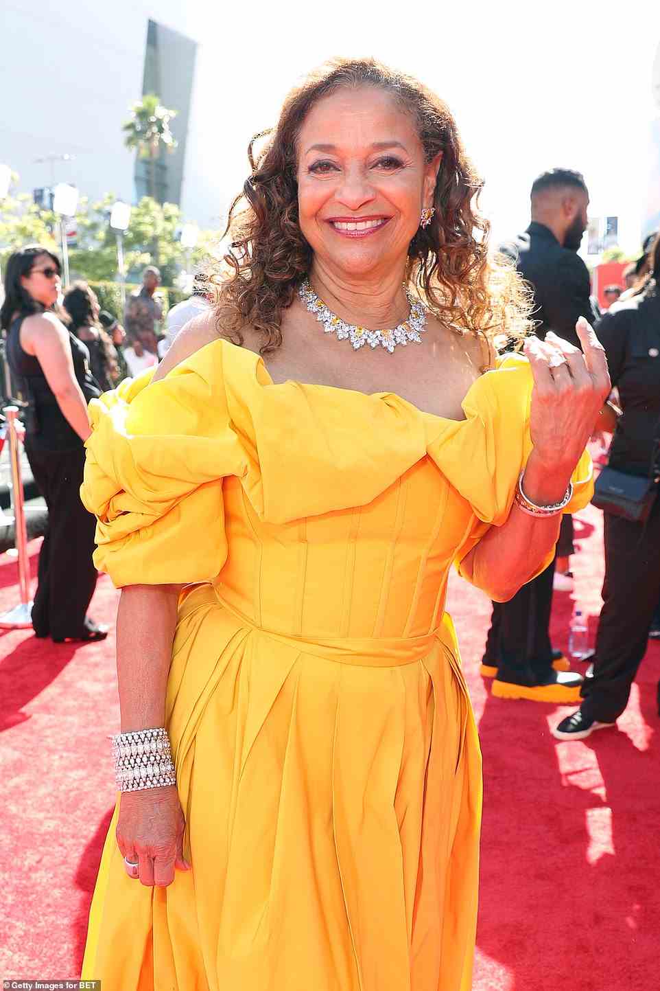 Sunshine: Debbie Allen, 72, exuded a bright glow in a stunning yellow gown, which she paired with a yellow diamond necklace