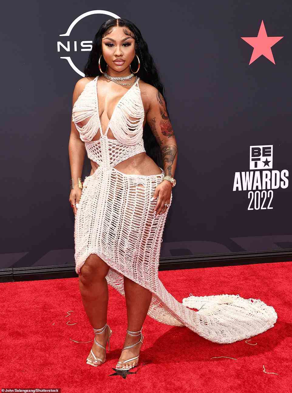 Crochet chic: Social media star Ari Fletcher, 26, put her curves on display in a white crochet dress with a train