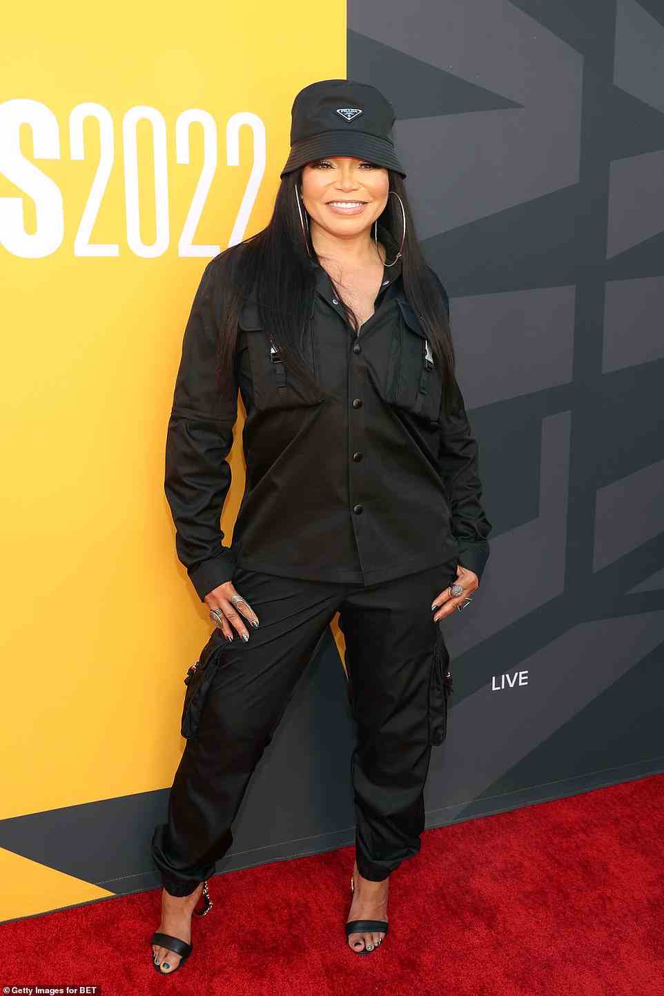Prada: Tisha Campbell, 53, was trendy in a Prada bucket hat and matching black top and pants