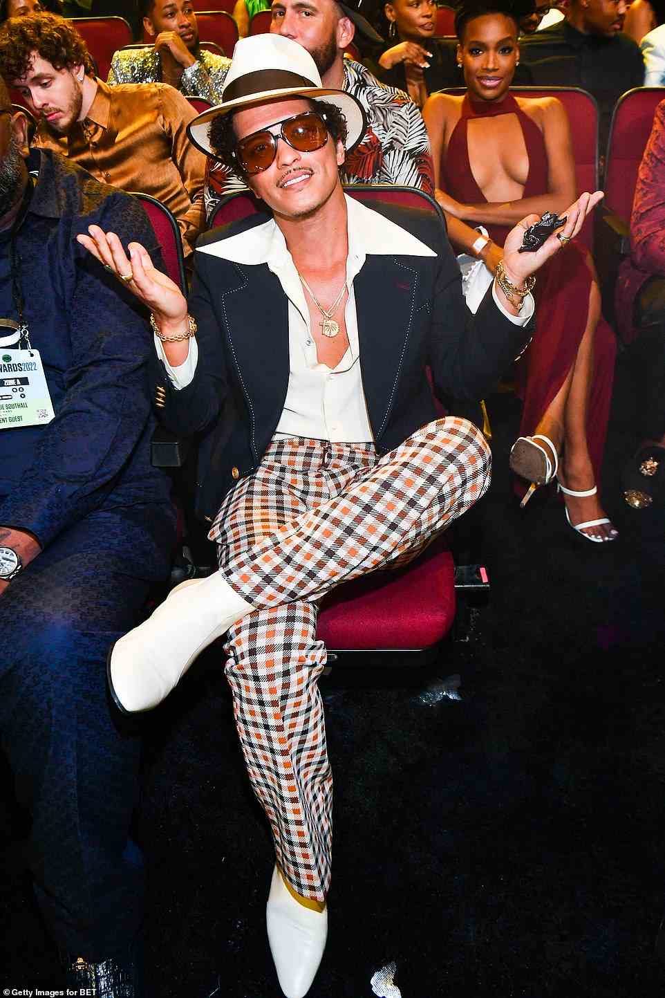 70's style: Though Bruno Mars, 36, skipped the red carpet, he was seen inside of the event rocking his usual trendy look