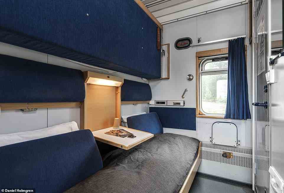Pictured above is a first-class compartment, which features 'comfortable beds' and a shower and toilet