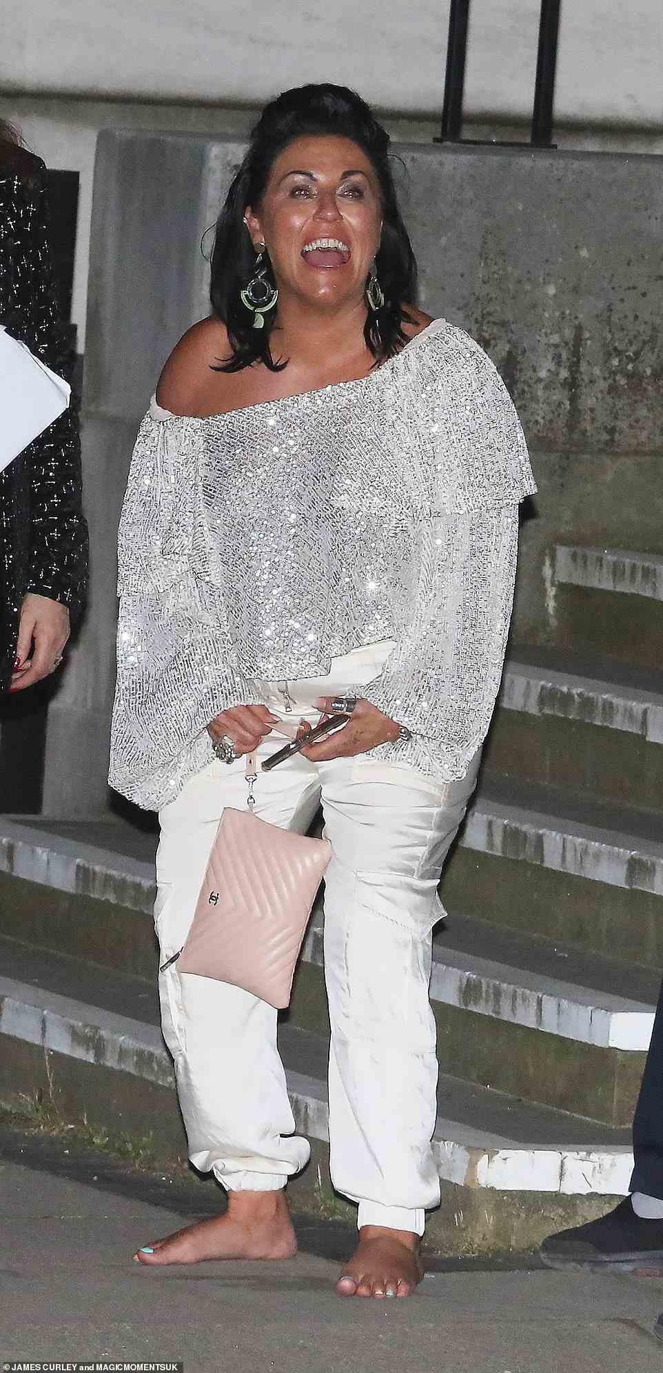 Emerging: EastEnders' Jessie Wallace went barefoot as she made a bleary-eyed exit from the British Soap Awards in London on Saturday night